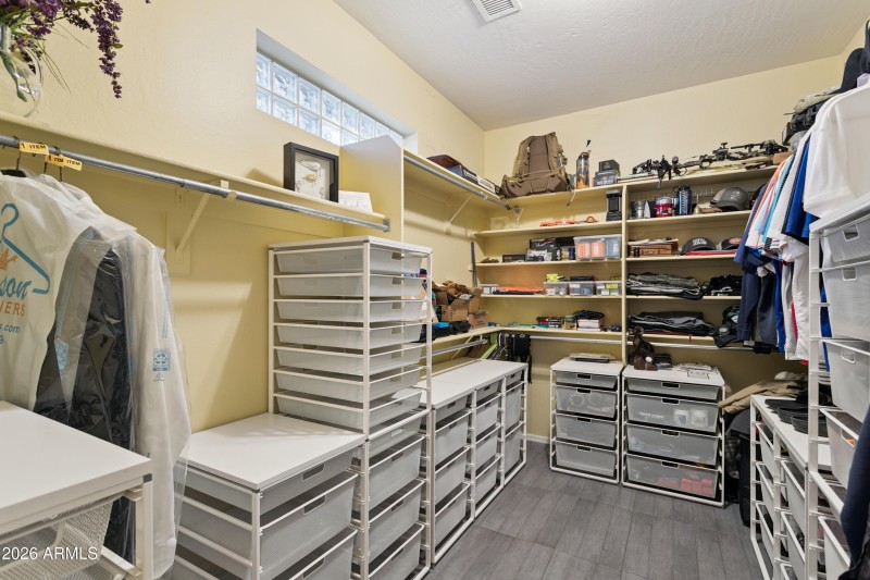 Primary bedroom walk in closet