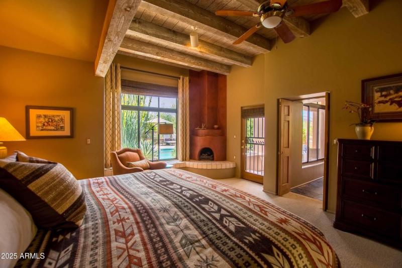master bedroom with view of the pool