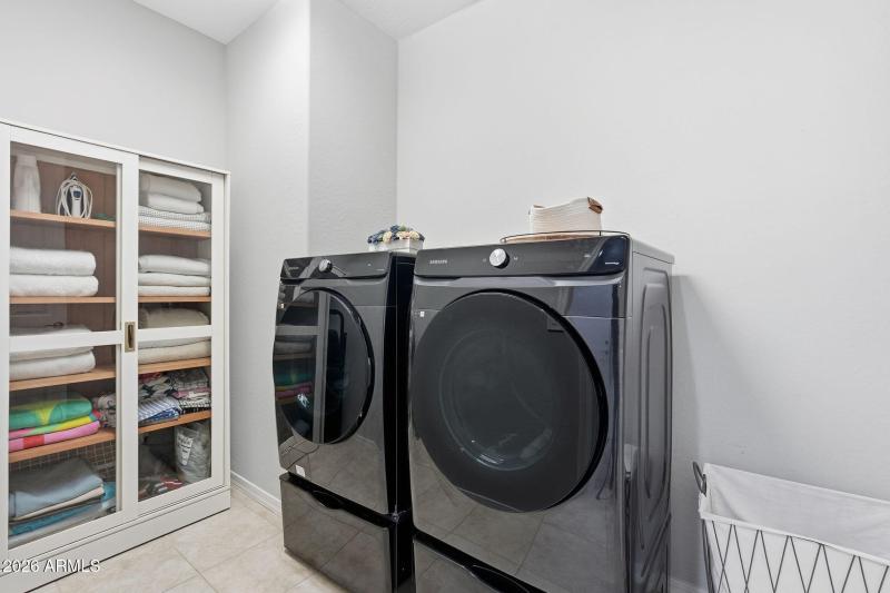 Separate Laundry room, cabinet conveys