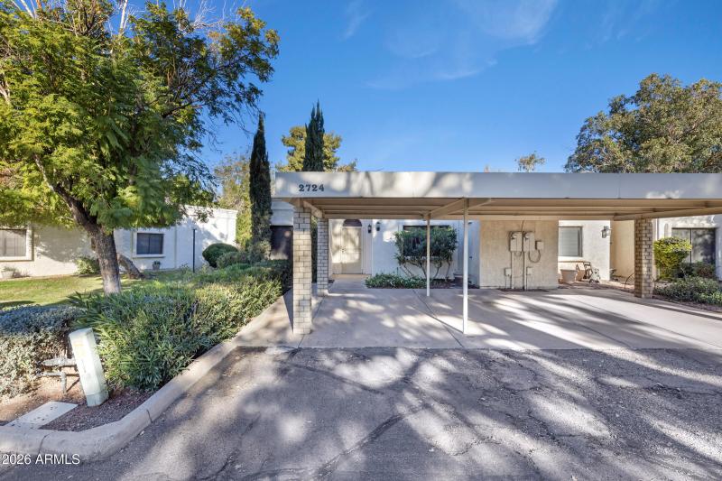 Front of home with 2 car carport