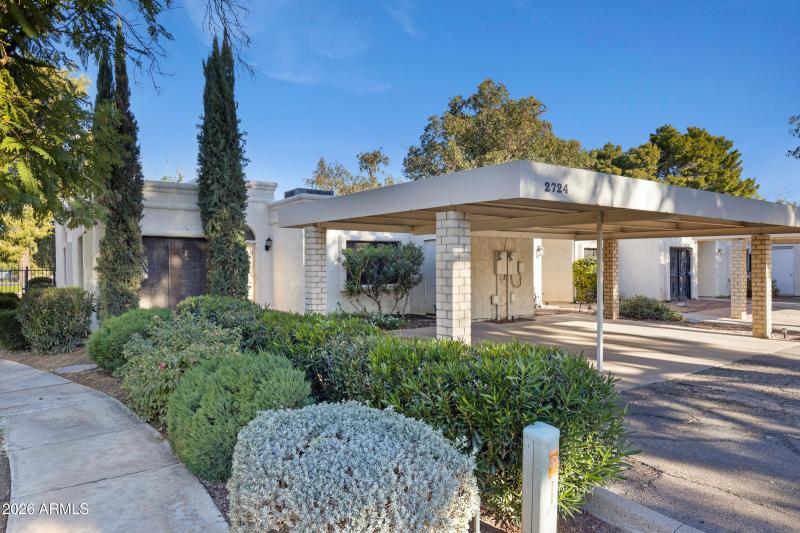 Two car carport in front of home