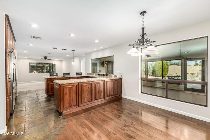 Informal dining space overlooks backyard