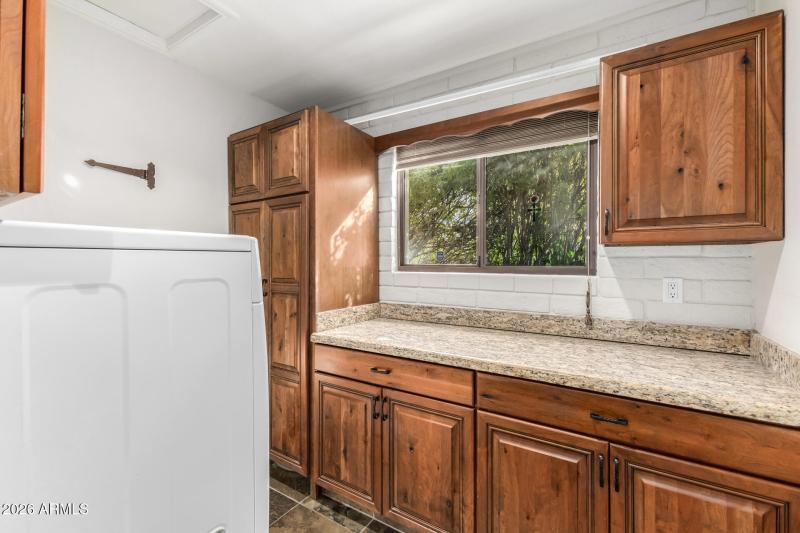 Laundry room on east side of home