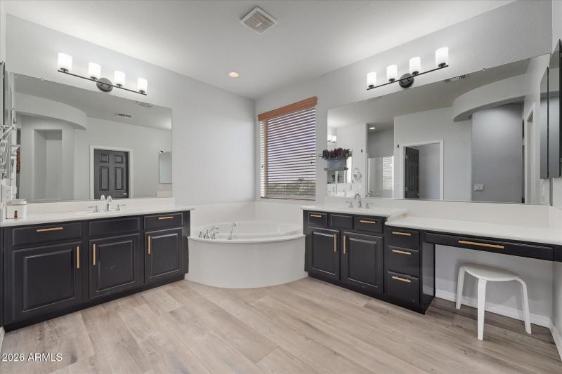 Primary bathroom with dual vanities