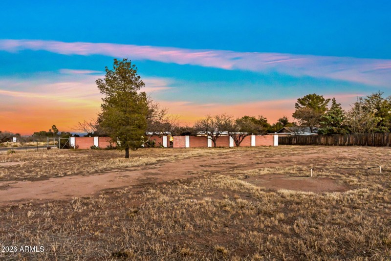 Yard past gated backyard