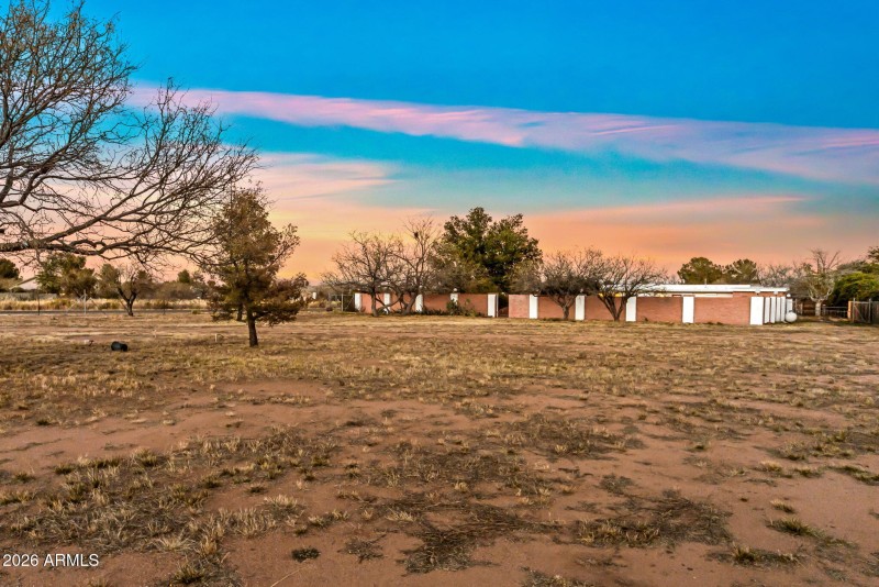Yard past gated backyard