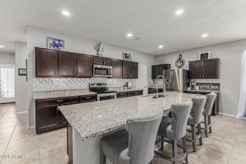 Spacious Kitchen With Custom Backsplash