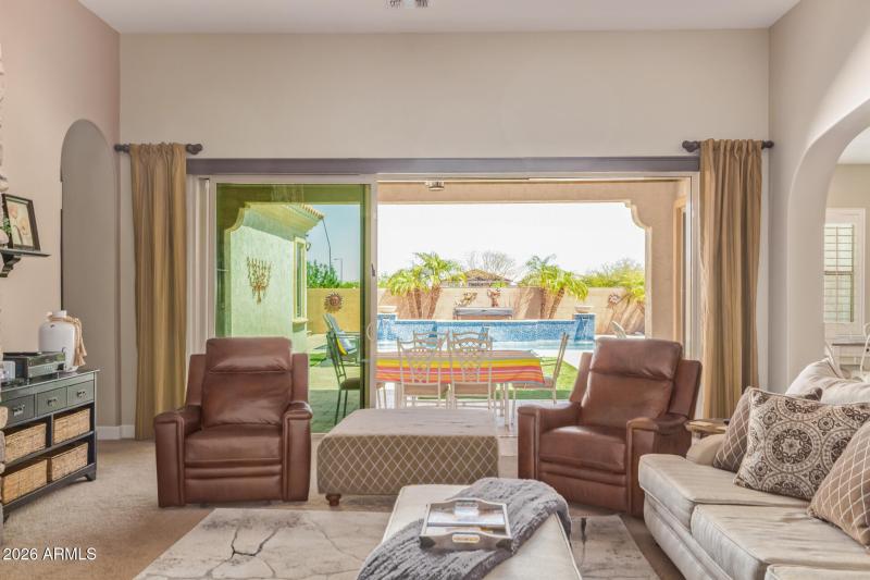 living area with a view of the pool