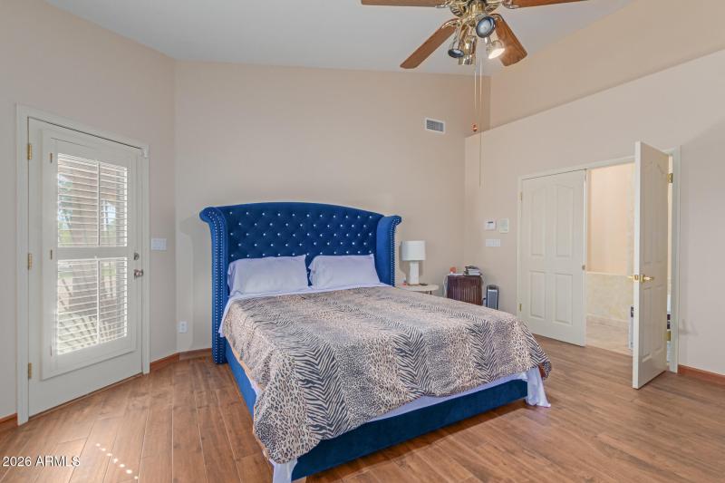 Primary bedroom with patio access