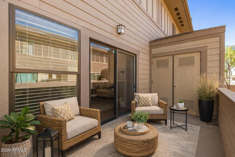 Cozy balcony with wicker seating