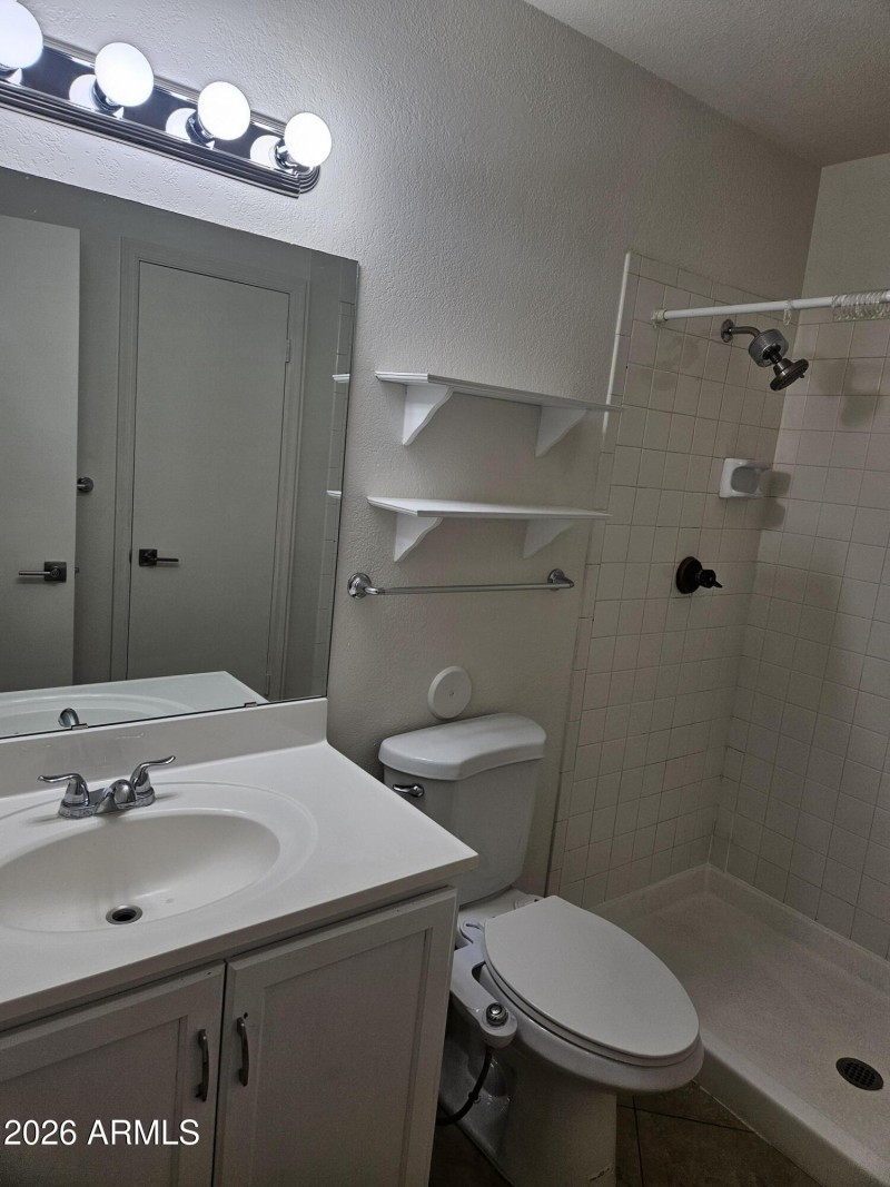 downstairs bdm bathroom with walk in sho