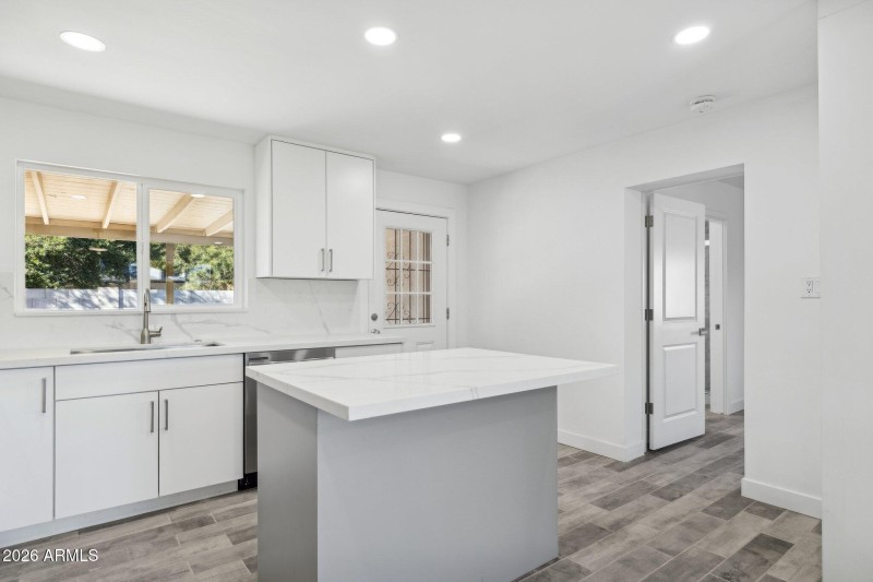Bright Kitchen with Backyard View
