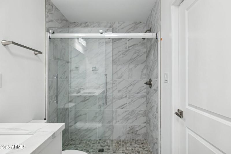 Glass Shower with Tile Walls
