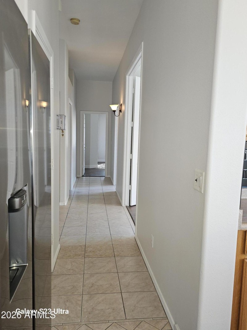 VIEW OF HALL WAY TOWARD SECONDARY BRs.