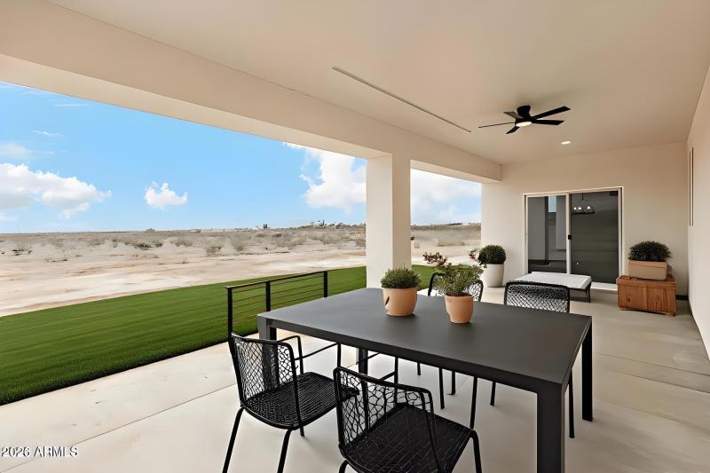 back patio with table green grass