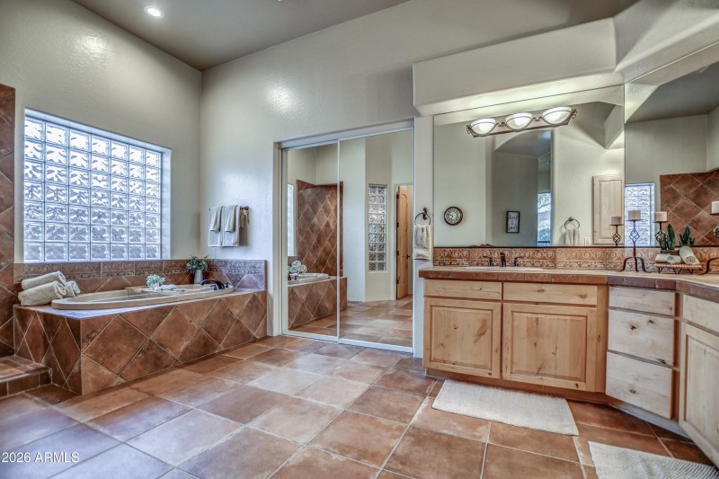 Primary bathroom tub closet entry