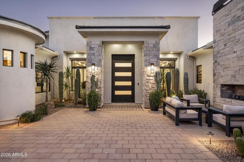 Gated front patio with fireplace