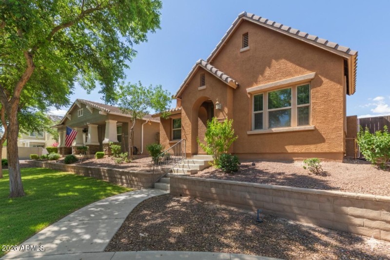 Front with neighbors flag and grass