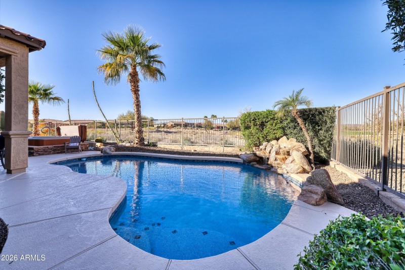 Pool w/ Waterfall and Golf Course Beyond