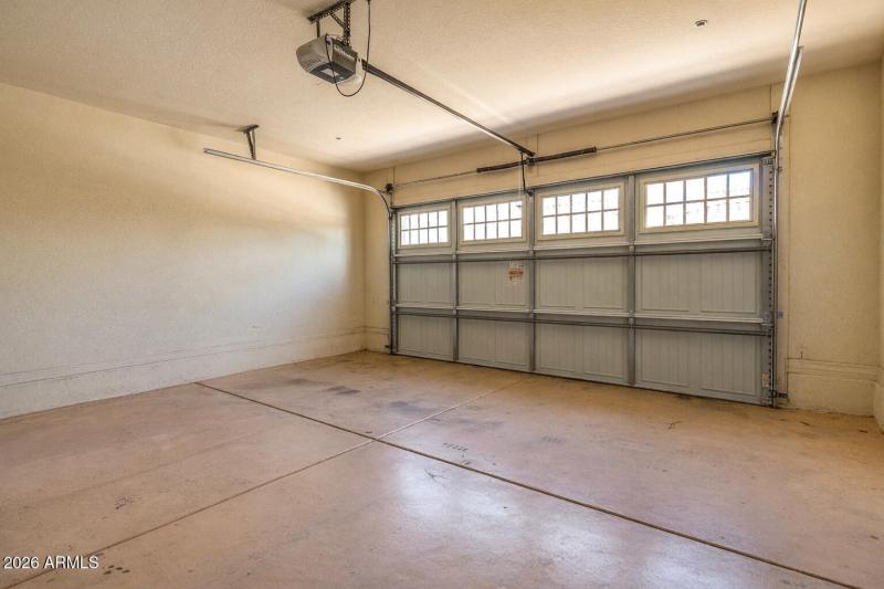 Empty garage with beige concrete floor