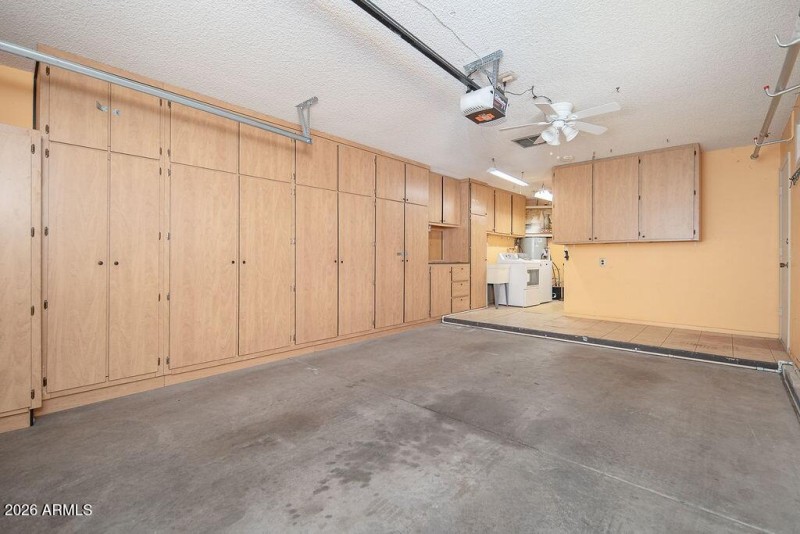 Garage with lots of Storage Cabinets