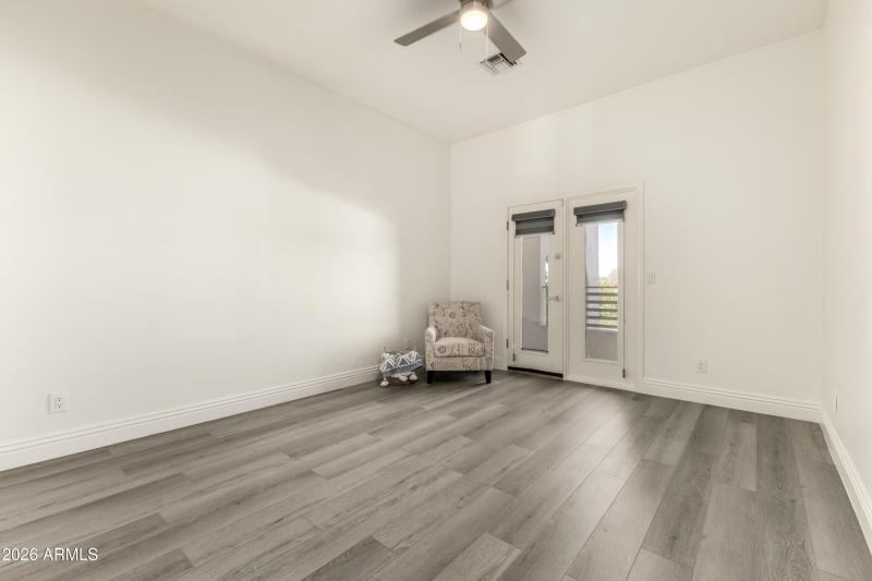Upstairs second bedroom with balcony