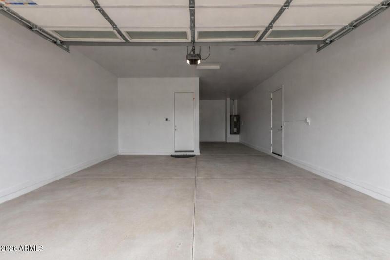 spacious garage with white walls (1)