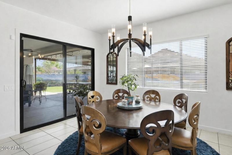 Modern dining space with patio view