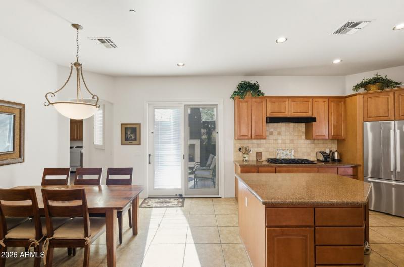 Kitchen to courtyard w/ fireplace