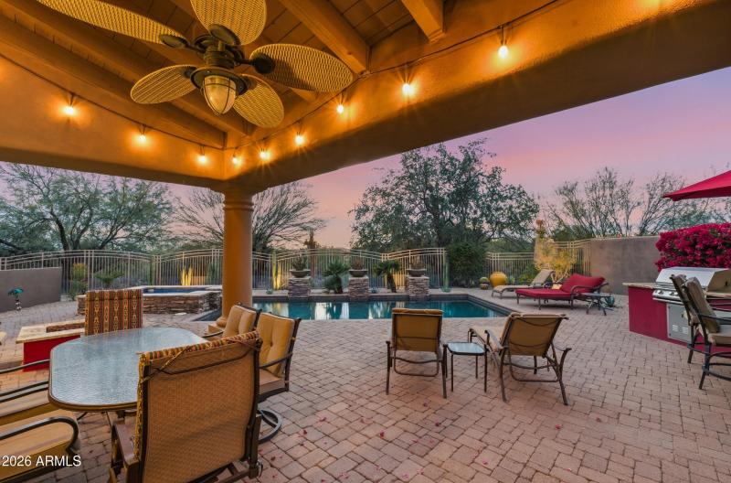 Covered patio overlooking pool