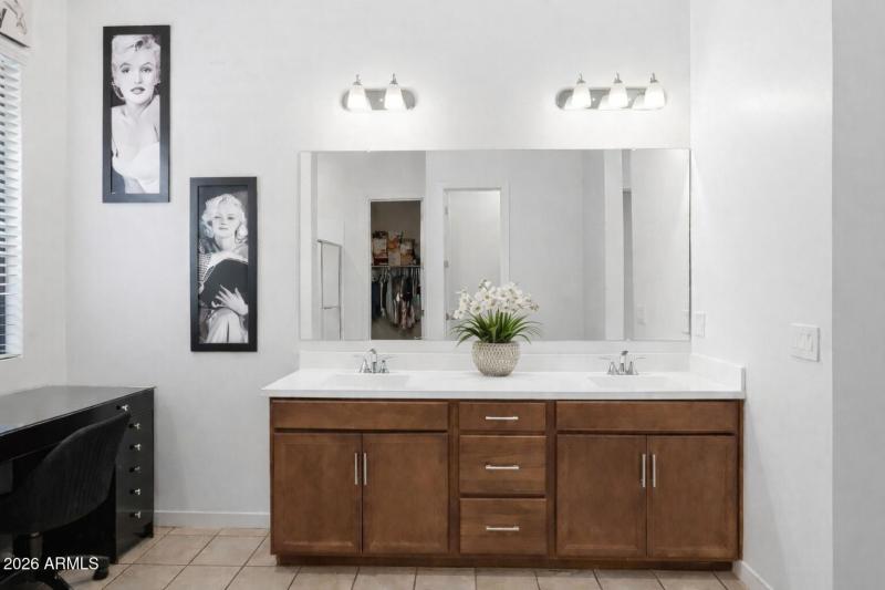 Modern bathroom vanity with portraits (1