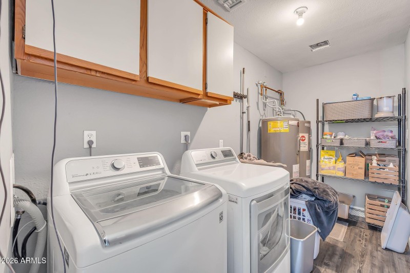 Large Laundry room with 2 water Heaters