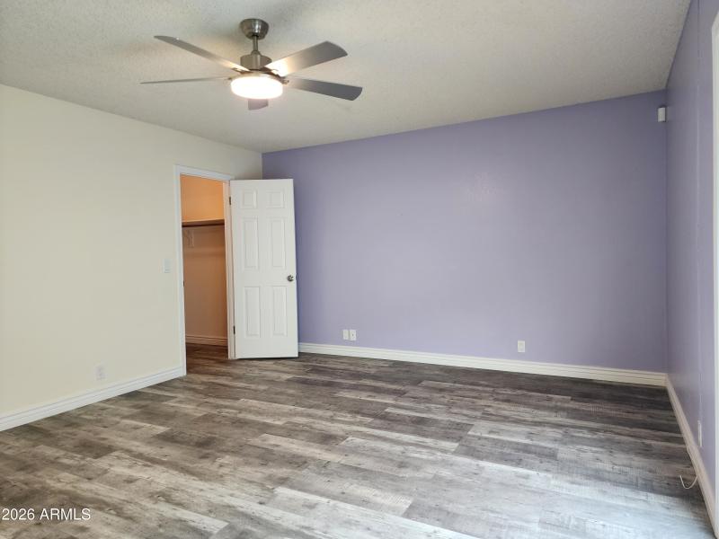 Large primary bedroom has walk in closet
