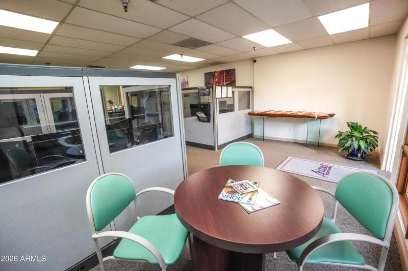 Reception Table with Cubicles in Backgro