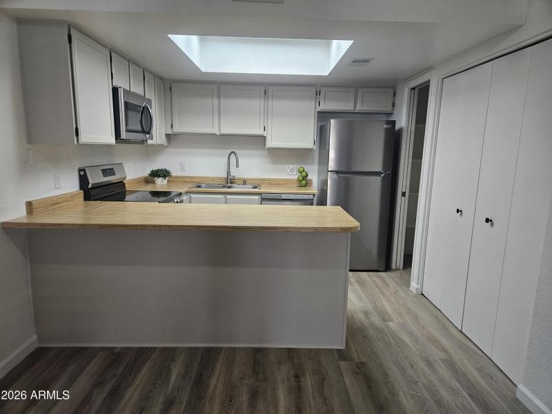 Kitchen and Bar with Appliances